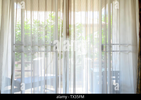 Light through the white curtains in the morning Stock Photo