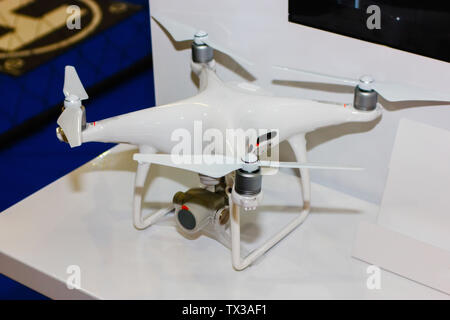 Quadcopter for flying on the radio. Drone for shooting photos and video from a height of flight. Stock Photo