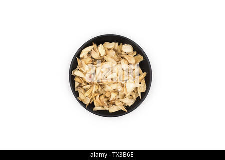 Dried lily tablets on white background, traditional Chinese medicine Stock Photo