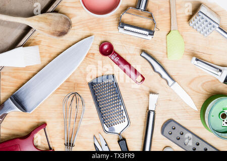 View from above kitchen utensils on wooden surface - knolling Stock Photo