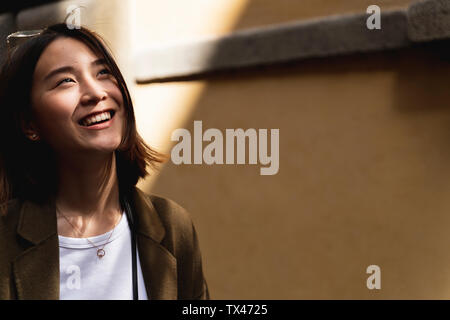 Italy, Florence, happy young woman in the city Stock Photo