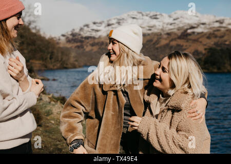UK, Scotland, happy female friends at Loch Lomond Stock Photo