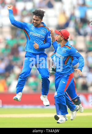 Afghanistan's Rashid Khan (left) celebrates the wicket of Bangladesh's Shakib Al Hasan before it was overturned during the ICC Cricket World Cup group stage match at The Hampshire Bowl, Southampton. Stock Photo