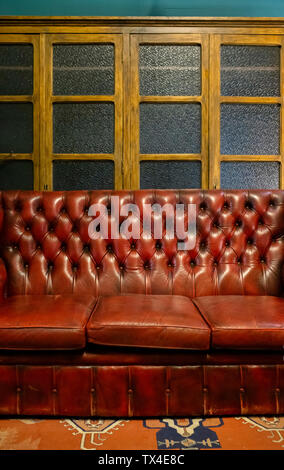Leather sofa in a vintage furniture shop Stock Photo