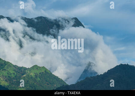 French Polynesia, Tahiti, dramatic mountains looming behind Papeete Stock Photo