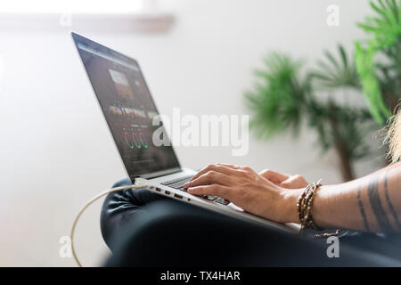Man's hand working on laptop, close-up Stock Photo