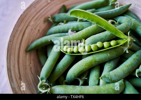 Freshly picked organic peas, close-up Stock Photo