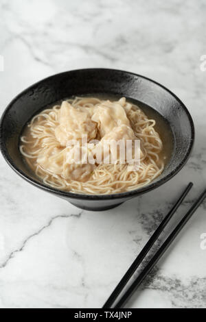 Cloud noodles on a marble table. Stock Photo