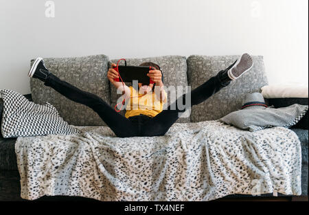 Excited boy playing video game on a games console Stock Photo