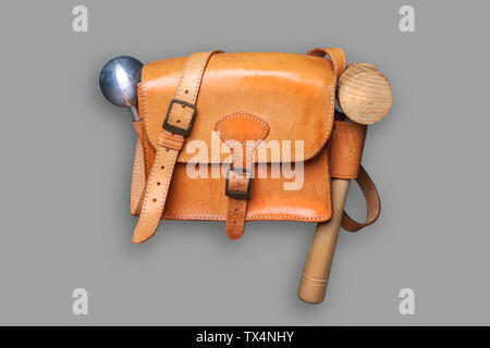 A  leather bag with tools for  Boellerschiessen. Boellerschiessen in Germany or Prangerschiessen in Austrian is the saluting gun shooting tradition th Stock Photo