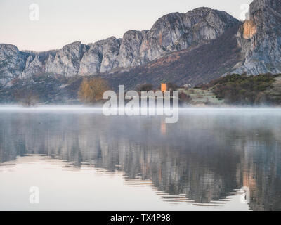 Spain, Asturias, Camposolillo, view over Porma reservoir with water vapour and Cantabrian Mountains Stock Photo