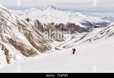 Georgia, Caucasus, Gudauri, man on a ski tour riding downhill Stock Photo