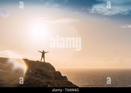 Faroe Islands, Vagar, man standing at the coast Stock Photo