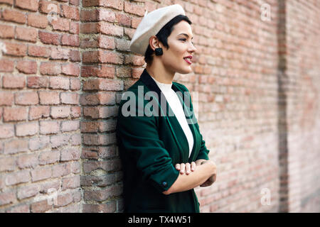 Fashion, wall and black woman with green clothes, fashionable style or cool hip  hop outfit. Fire