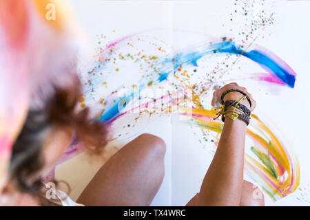 Close-up of woman painting on canvas Stock Photo