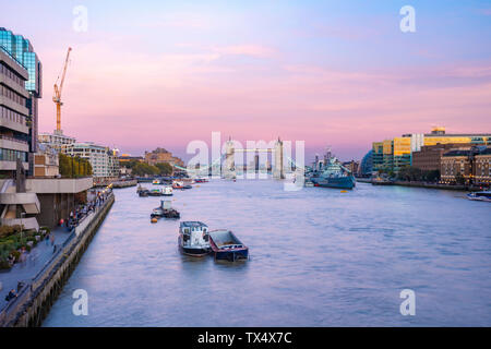 UK, London, The Tower Brigde with the HMS Belfast at sunset with purple sky