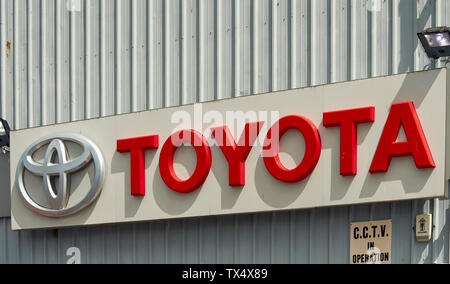 TOYOTA GARAGE SIGN  ON THE OUTSIDE  WALL OF THE MAIN BUILDING Stock Photo