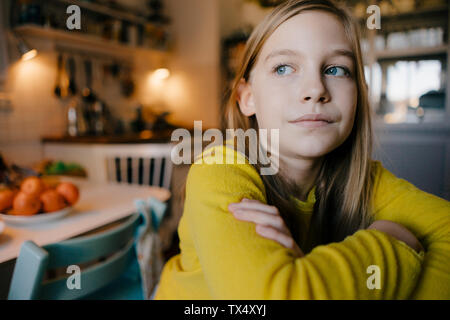 Portrait of pensive girl at home Stock Photo