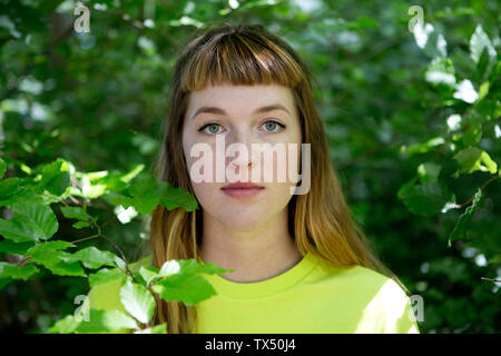 Portrait of young woman in the forest Stock Photo