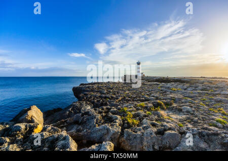 Spain, Balearic Islands, Mallorca, Colonia de Sant Jordi, Lighthouse at sunset Stock Photo