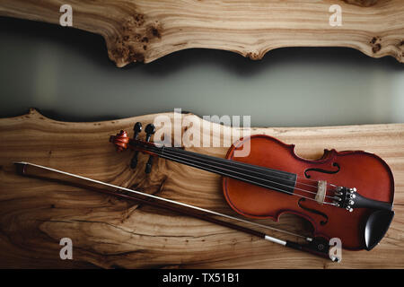 Violin and bow on wood Stock Photo