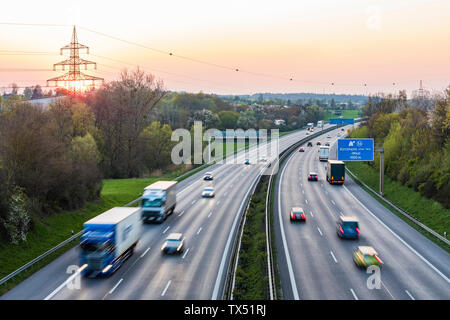 Germany, Baden-Wuerttemberg, traffic on Autobahn A8 at sunset Stock Photo