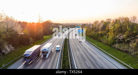 Germany, Baden-Wuerttemberg, traffic on Autobahn A8 at sunset Stock Photo