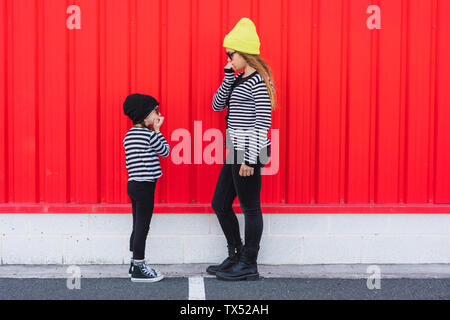Teenage girl and little sister having fun together Stock Photo