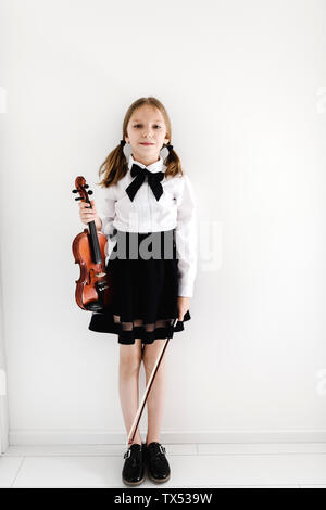 Portrait of girl holding a violin Stock Photo