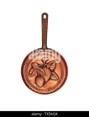 Vintage copper pan with a handle for baking engraved with strawberries isolated Stock Photo