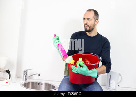 A man with cleaning products. Stock Photo