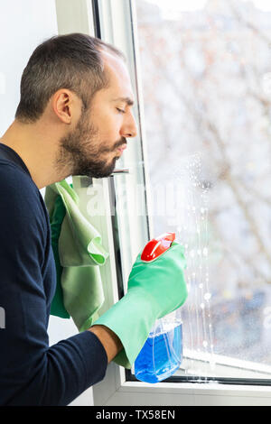 A man cleaning a window. Stock Photo
