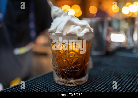 Affogato, Italian coffee-based dessert with vanilla ice cream topped or drowned with a shot of hot espresso. Some variations also include a shot of am Stock Photo