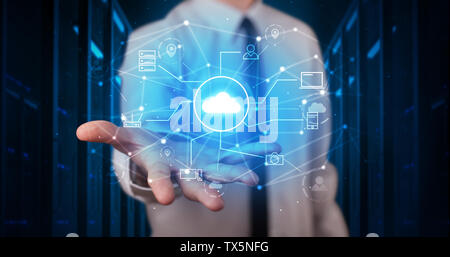 Man holding hologram projection displaying cloud technology symbols  Stock Photo