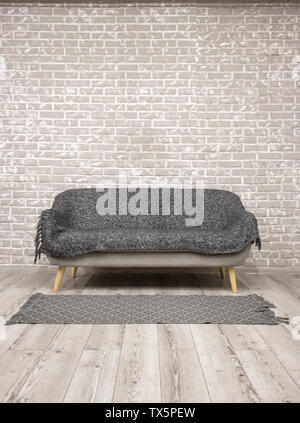 Background with brick wall and wooden floor with sofa in middle Stock Photo
