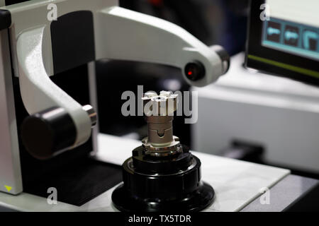 CNC tool presetting and measuring machine. Selective focus. Stock Photo