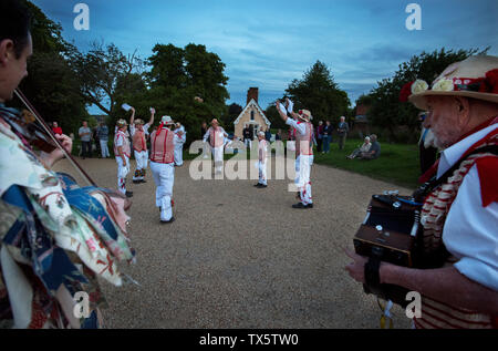 Thaxted Morris Men at the Thaxted Patronal Festival, Thaxted Essex, England. 22 6 2019 Thaxted Morris Men perform outside Thaxted Church Stock Photo