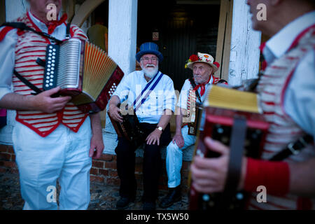 Thaxted Morris Men at the Thaxted Patronal Festival, Thaxted Essex, England. 22 6 2019. Dancing at the GuildHall,processing to the Church. Stock Photo