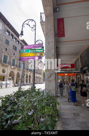 PALMA, MALLORCA, SPAIN - JUNE 22, 2019: Shopping street Jaime III with wellknown brand name Camper and information sign on a sunny day on June 22, 201 Stock Photo