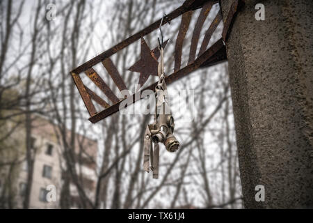 Old Gas mask in settlement, Chernobyl Exclusion Zone, Ukraine Stock Photo