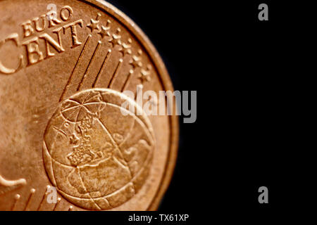 coin one eurocent macro isolated on black background. Detail of metallic money close up. EU money. Stock Photo