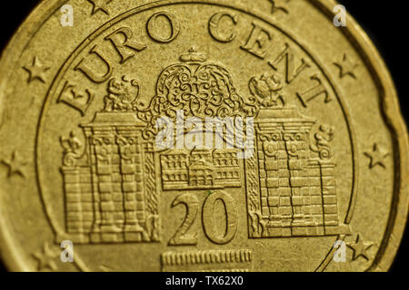 coin twenty euro cent macro isolated on black background. Detail of metallic money close up. EU money. Stock Photo