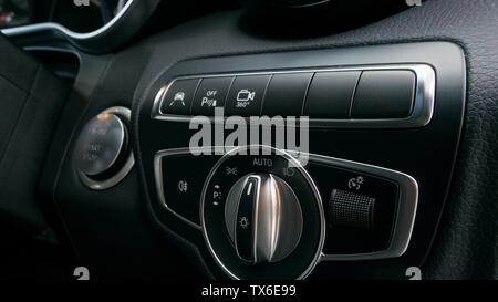 Light controls and buttons for technology features in a car Stock Photo