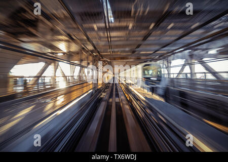 Motion blur of Automatic train moving inside tunnel in Tokyo, Japan. Stock Photo