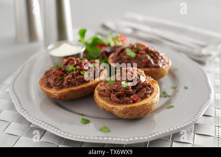 pulled pork baked potatoes Stock Photo