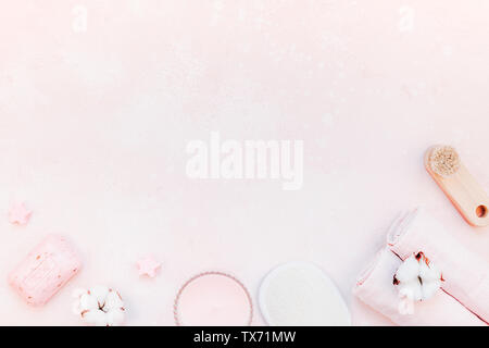 Spa, beauty cosmetics and body care treatment concept with copy space. Creative top view flat lay composition with bath accessories and rose soap cott Stock Photo