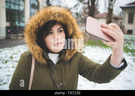 young caucasian woman using smartphone outdoor – technology, vacation, new generation Stock Photo