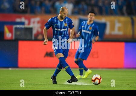 Argentine-born Italian football player Gabriel Paletta of Jiangsu Suning  dribbles against Shanghai Greenland Shenhua in