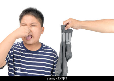 hand man holding dirty stinky socks isolated on white background, unpleasant smell concept Stock Photo