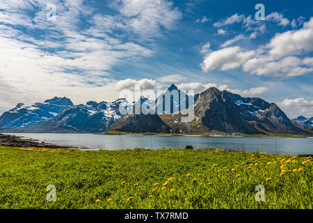 Beautiful and dramatic fjord, Lofoten Islands, Norway on a bright sunny spring day with last snows on the mountains Stock Photo